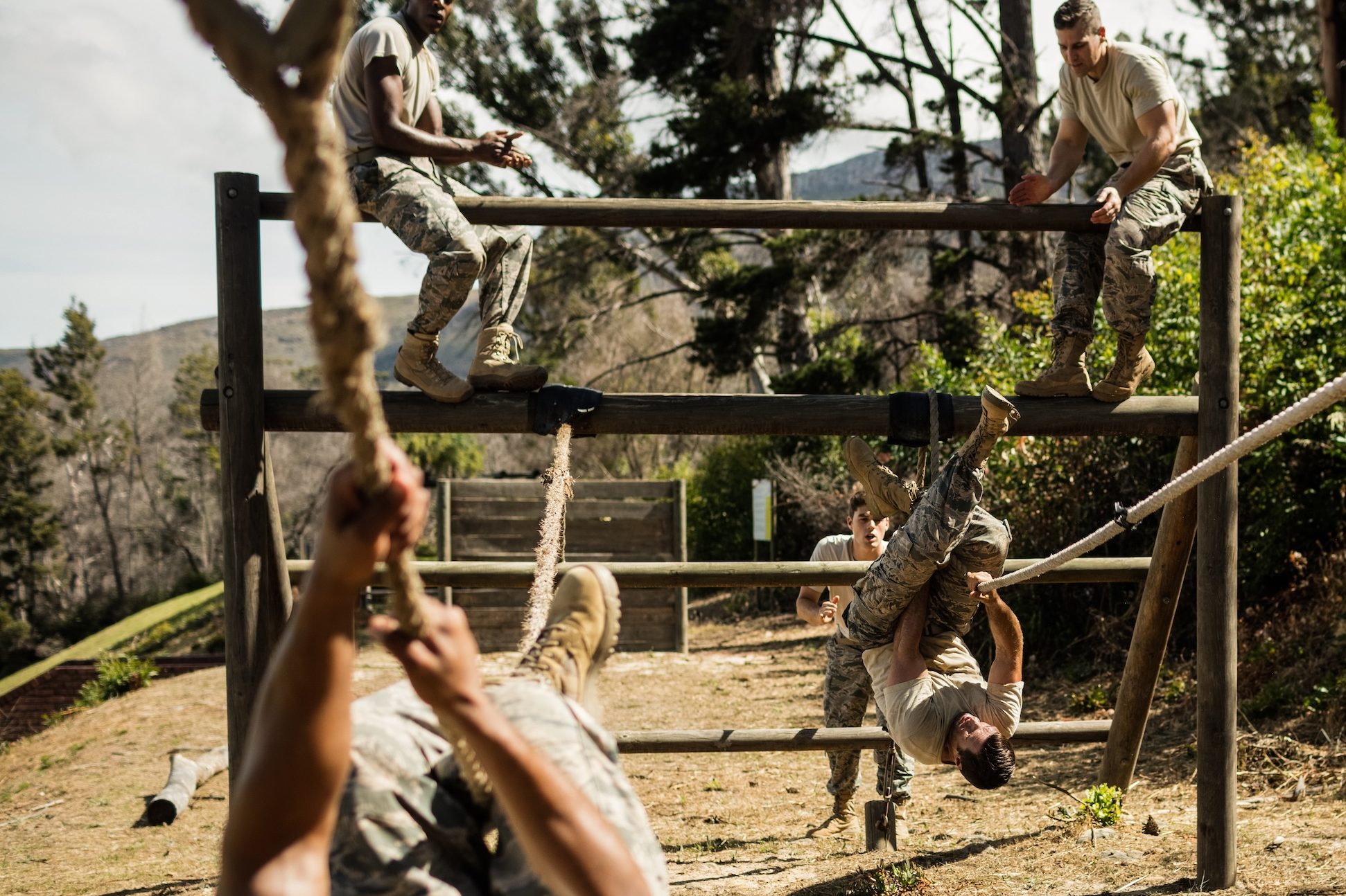 Army Ropes Course Hd Young military soldiers practicing rope climbing during obstacle course ...